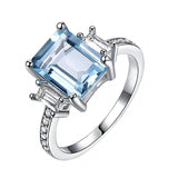 Sterling Silver Emerald Cut 7 * 9MM Sky Blue Aquamarine and White Moissanite  Engagement Ring